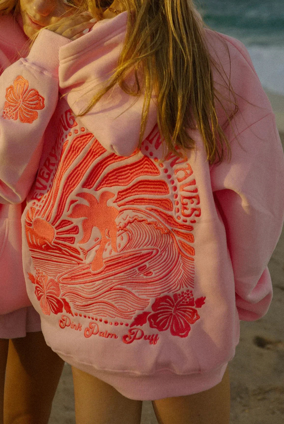 Breathable women's summer hoodie with a relaxed fit, ideal for layering or activewear on warm days.