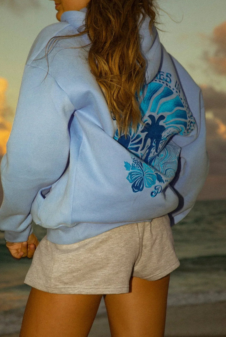 Stylish women's lightweight hoodie in pastel, a versatile layering piece for comfortable summer fashion.