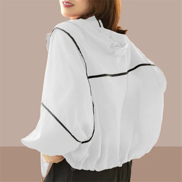 Comfortable women's oversized summer hoodie, a lightweight hooded jacket for relaxed, stylish spring fashion.