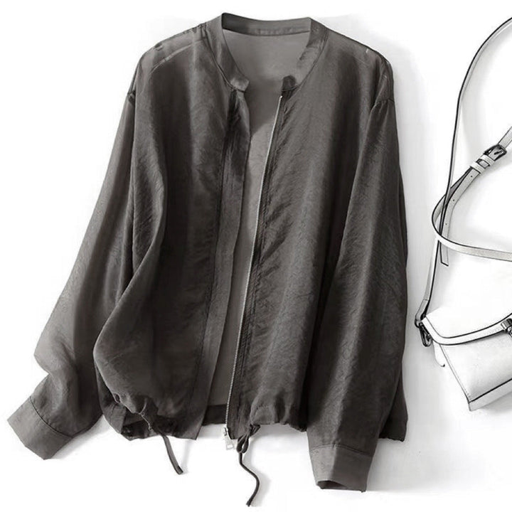 Relaxed fit pink women's lightweight jacket, perfect for summer outerwear. Features a versatile drawstring hem.