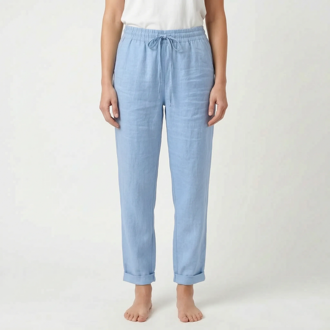 Woman wearing ankle-length tapered summer pants, relaxed fit & lightweight, ideal for a stylish casual look.