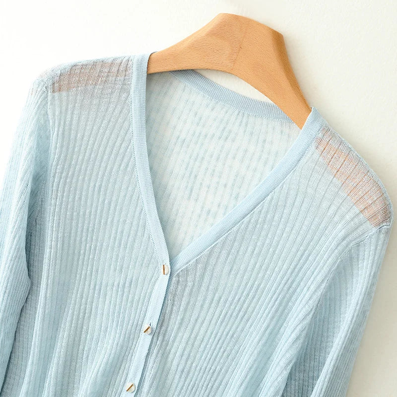 Spring/fall women's lightweight V-neck cardigan sweater. Easy layering piece for comfortable, versatile daily wear.