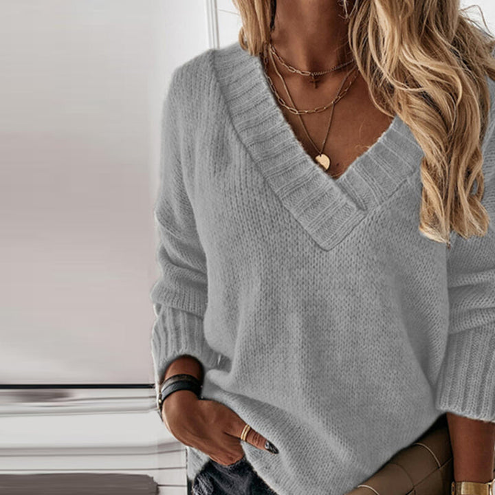 Comfortable women's V-neck knit pullover sweater. Versatile lightweight top for casual wear in any season.
