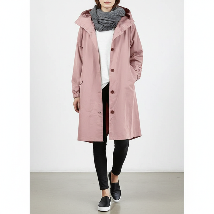 Stylish women's lightweight rain jacket in a vibrant color, water-repellent and travel-friendly