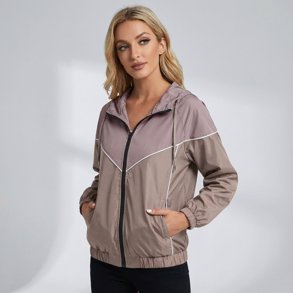 Women's activewear windbreaker, water-repellent, with adjustable hood and color block.