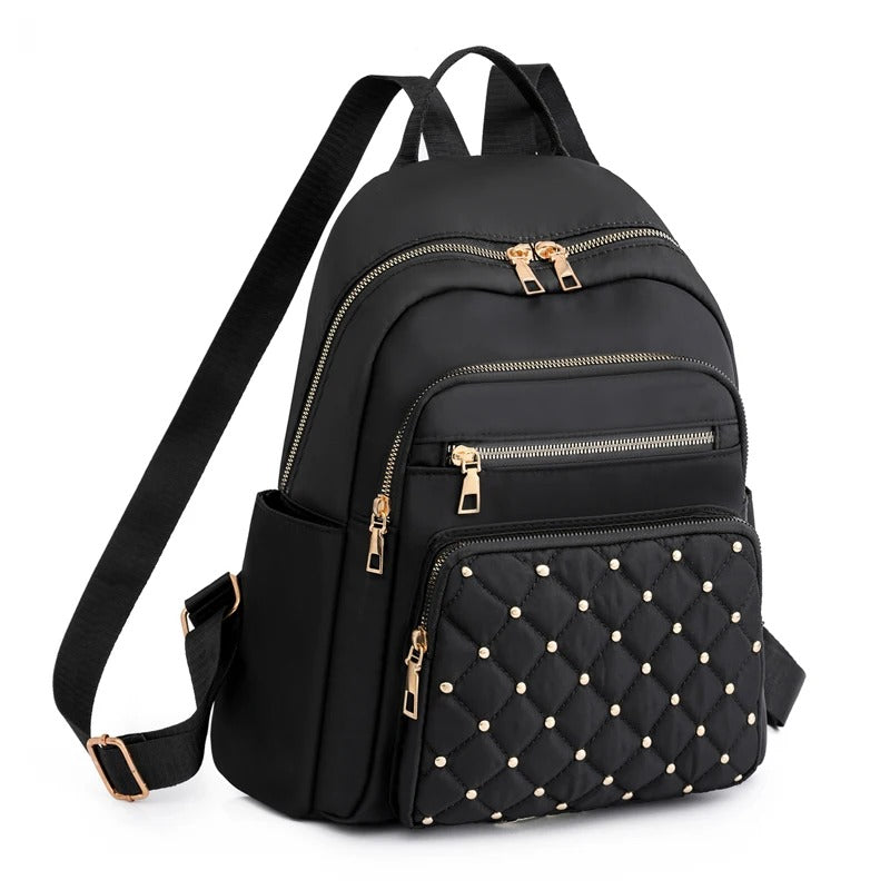 Women's lightweight water-resistant nylon backpack, perfect for travel & school. Stylish daily carry bag.