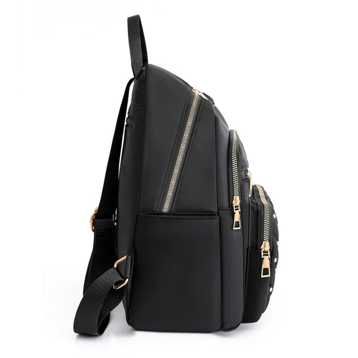 Student carrying women's lightweight nylon school backpack on campus. Water-resistant, ideal for books & daily essentials.