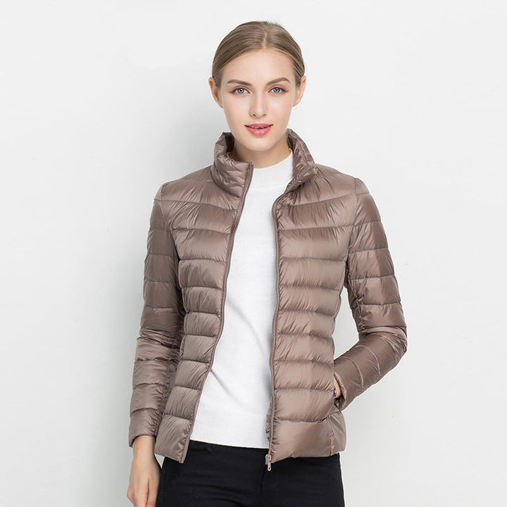 Women's lightweight waterproof puffer jacket for all-season comfort.