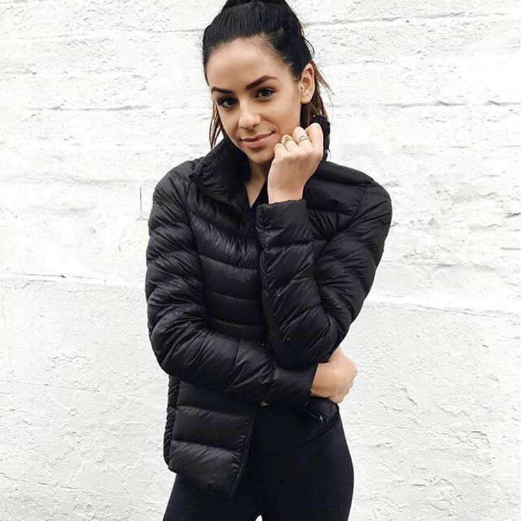 Modern women's waterproof lightweight jacket, merging urban fashion with outdoor utility.