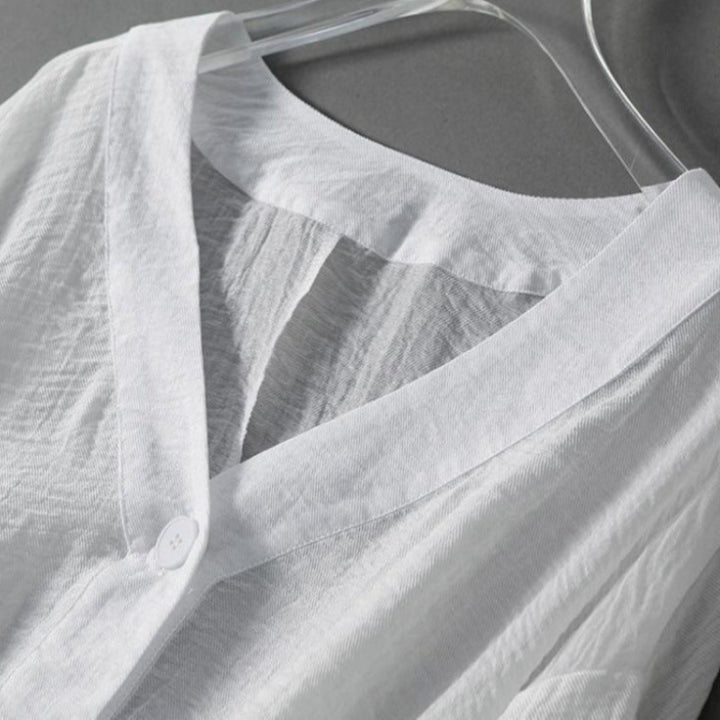 Flowy women's lightweight blouse in white, featuring comfortable balloon sleeves and a button front for summer fashion.