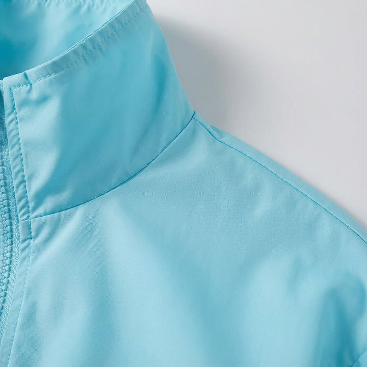 Close-up of women's outdoor jacket, showcasing lightweight and windproof features for sports