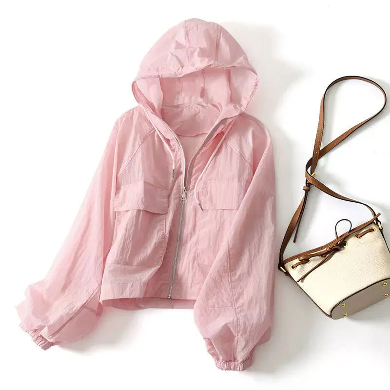 Gray women's lightweight zip-up hoodie. Breathable & stylish activewear for athletic activities & everyday comfort.