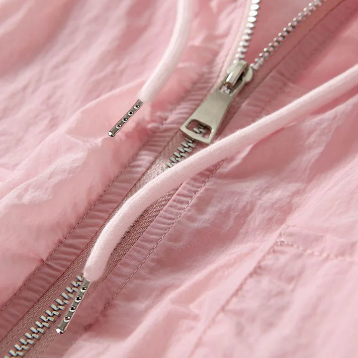 White lightweight women's zip-up hoodie for ultimate comfort. Versatile, breathable casual wear & athletic style.