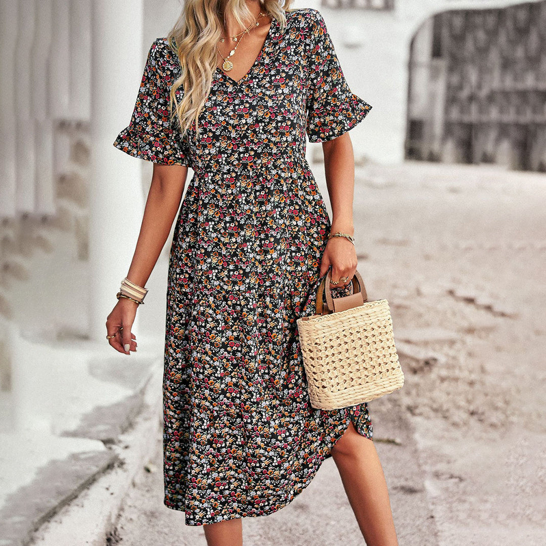 Elegant women's floral midi dress in lilac, ideal for summer events, vacations & flattering fit.