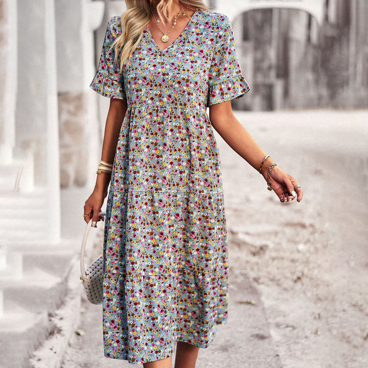 Flattering women's lilac floral print midi dress, a versatile piece for elegant or casual summer outfits.