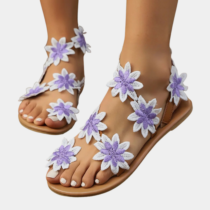 Stylish Lina floral flat sandals for women. Versatile for beachwear, summer fashion, or elegant casual garden parties.