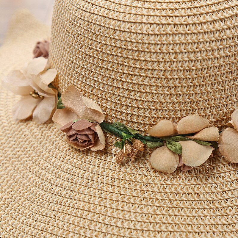 Side view of a women's Liora summer hat featuring a beautiful floral pattern and wide brim for sun protection
