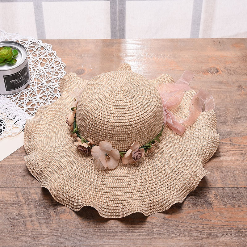 Detail of the floral pattern on a women's Liora summer hat, highlighting the vibrant colors and design