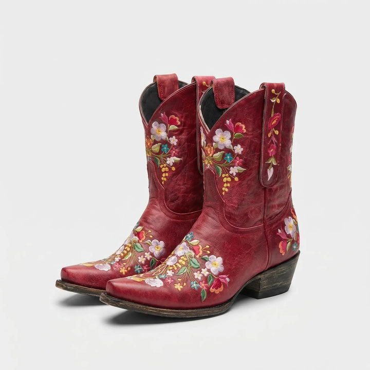 Unique women's pull-on western ankle boots, featuring elegant floral embroidery and a comfortable fit.