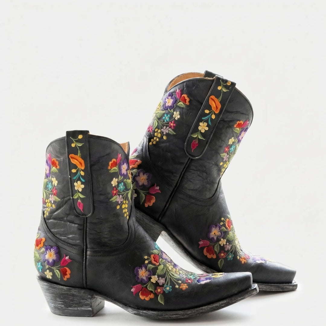 Stylish women's western ankle boots with intricate floral embroidery, adding a cowboy flair to any outfit.