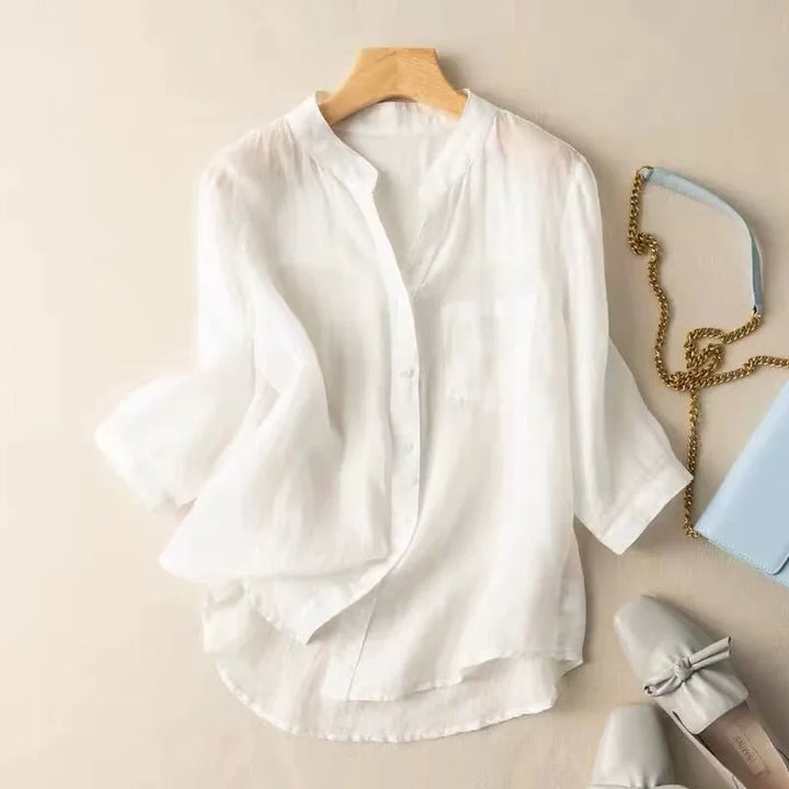 Stylish sky blue women's blouse featuring a comfortable relaxed fit and elegant mandarin collar for everyday wear.