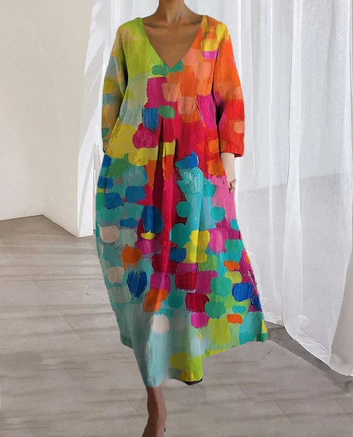 Flowy Women's Livia V-neck printed dress in bright colors, ideal for casual summer style or spring fashion events.