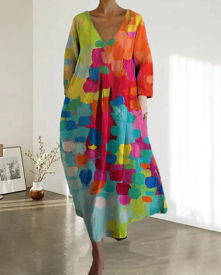 Livia women's V-neck dress with a beautiful colorful print, a flowy maxi perfect for versatile spring and summer wear.
