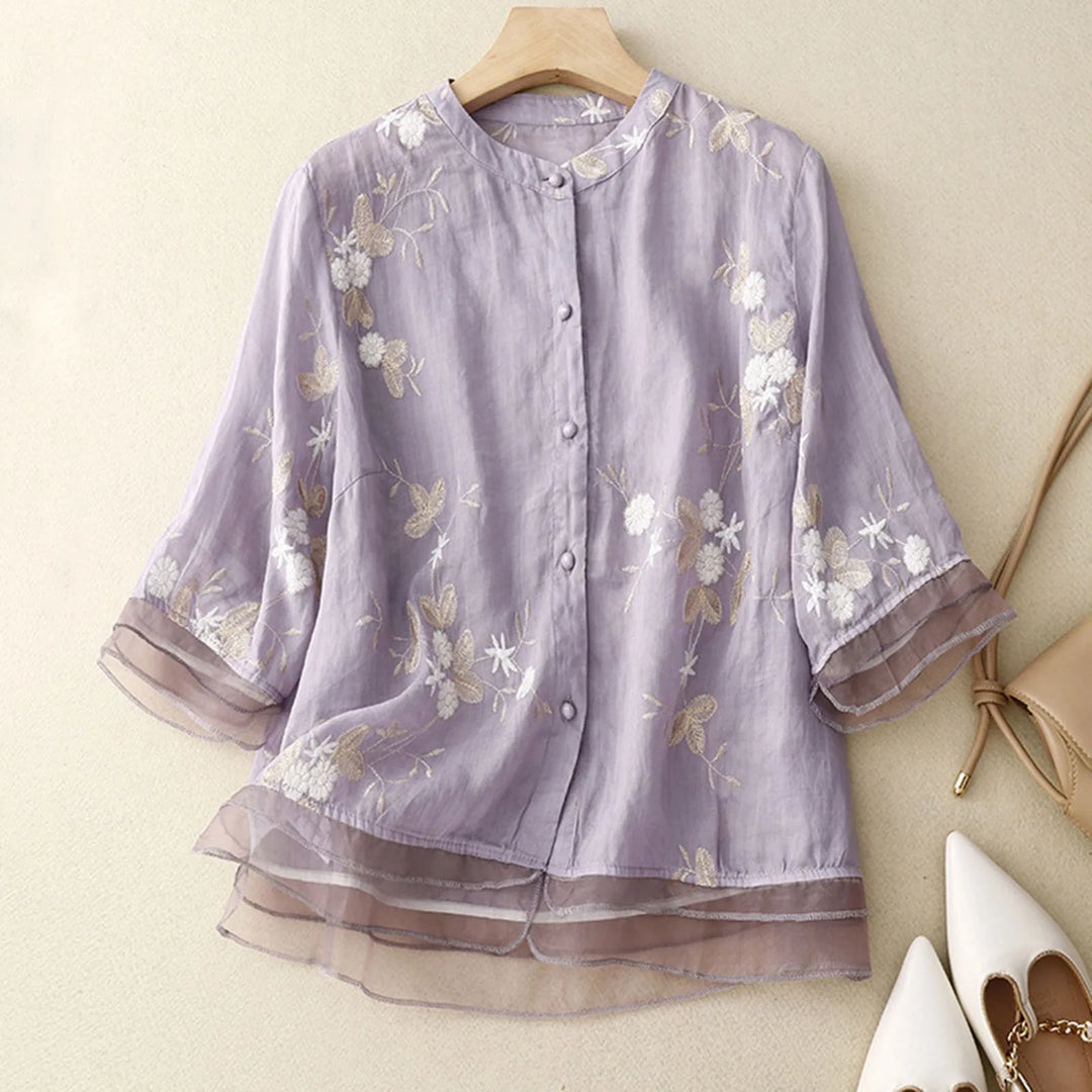 Women's Élodie Bloom floral embroidered sheer blouse, elegant spring/summer fashion.