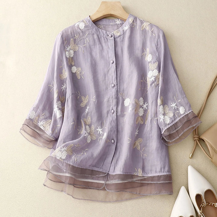 Women's Élodie Bloom floral embroidered sheer blouse, elegant spring/summer fashion.