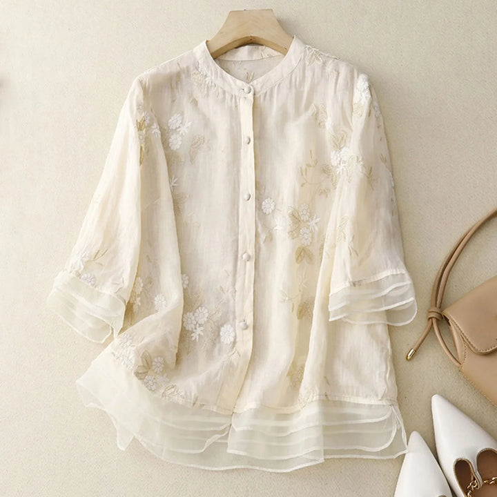 Elegant Élodie Bloom women's sheer top, intricate floral embroidery details, ideal for summer style.