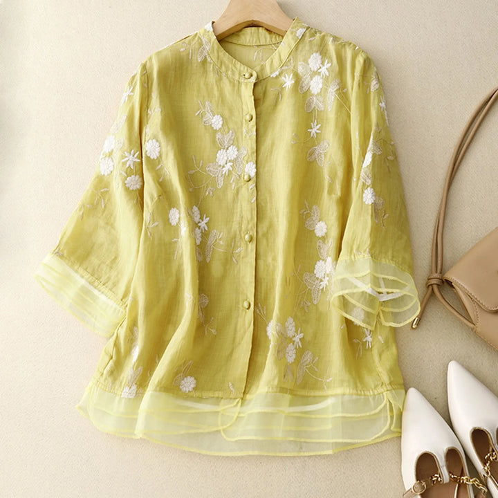 Beautiful Élodie Bloom sheer blouse, vibrant floral embroidery, available in green, white, yellow.