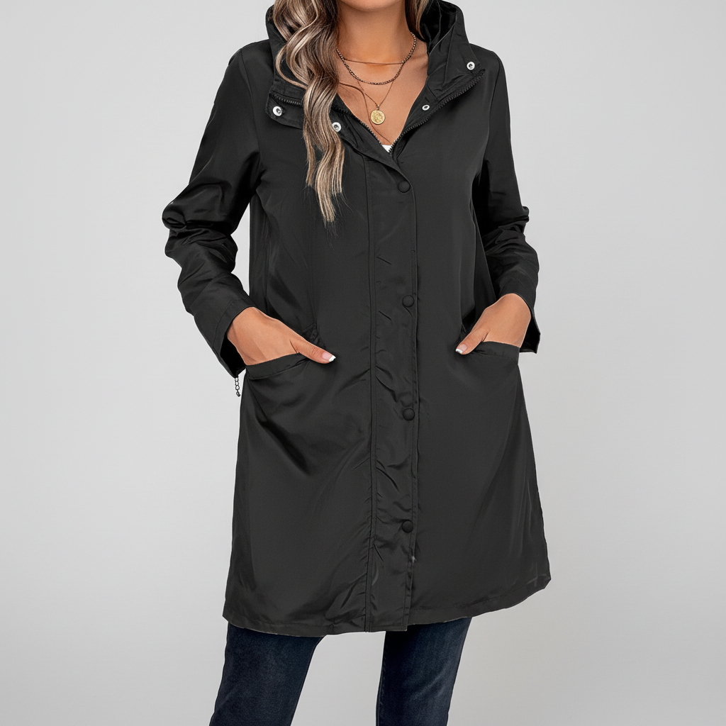 Elegant women's long coat, ideal for autumn, featuring button closure and high collar design