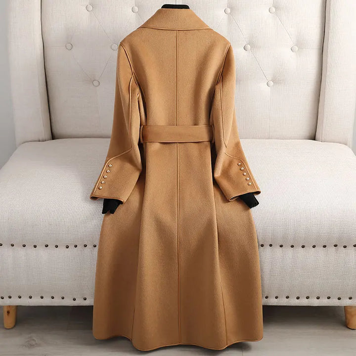 Elegant women's tailored trench coat with belt, long fit. Ideal for office attire & versatile fall fashion.