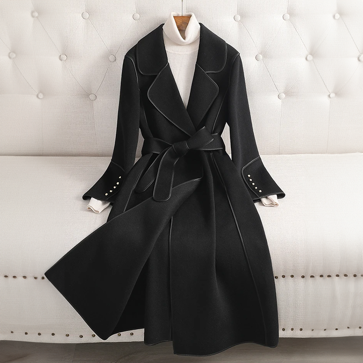 Tailored long trench coat for women, belted for a flattering fit. Essential fall and winter fashion outerwear.