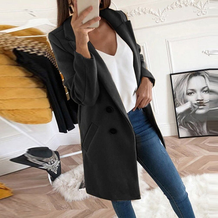 Women's long blazer coat, elegant for autumn/winter outerwear layering.