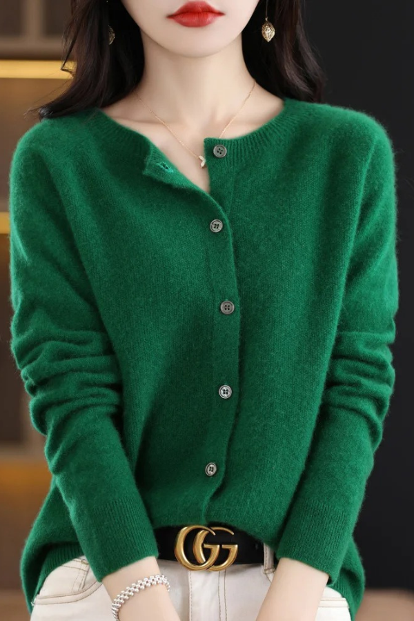 Close-up of buttons on a cozy women's long cardigan, highlighting detail and quality of the stylish layer.