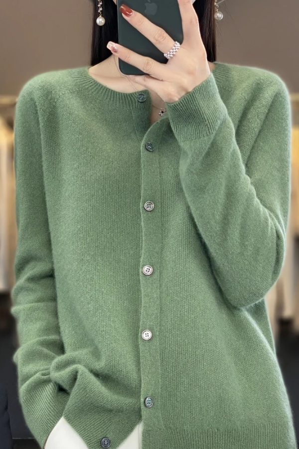 Woman in a flattering long button-front cardigan, showcasing its elegant drape and versatile fashion appeal.