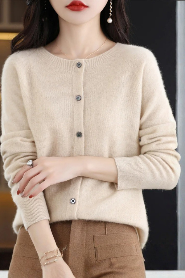 Modern women's long button-front cardigan. Versatile, comfortable, and chic addition to any wardrobe.