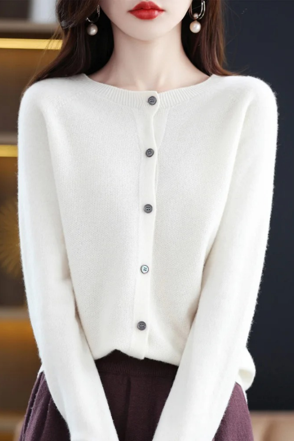 Transitional women's long button-front cardigan. Essential outerwear for casual or elegant layered looks.