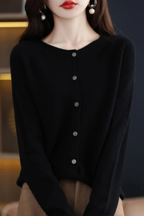Soft knit women's long cardigan with button-front. A comfortable, stylish, and versatile fashion piece.