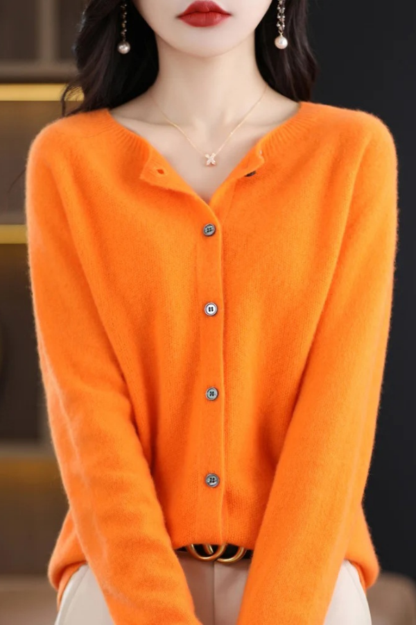 Woman wearing a long button-front cardigan, styled for a casual chic and comfortable look.