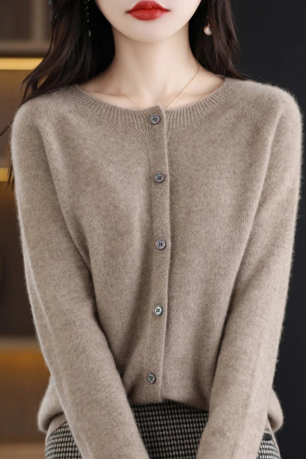 Textured women's long cardigan with functional button-front. Perfect for versatile layering and office style.