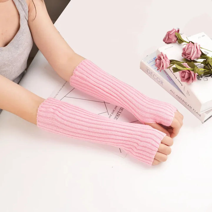Women's long fingerless knitted gloves, providing cozy winter warmth & stylish comfort for cold days.