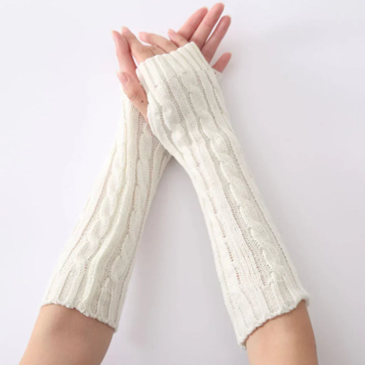 Fashionable long fingerless knitted winter gloves for women, offering warmth without sacrificing style or mobility.