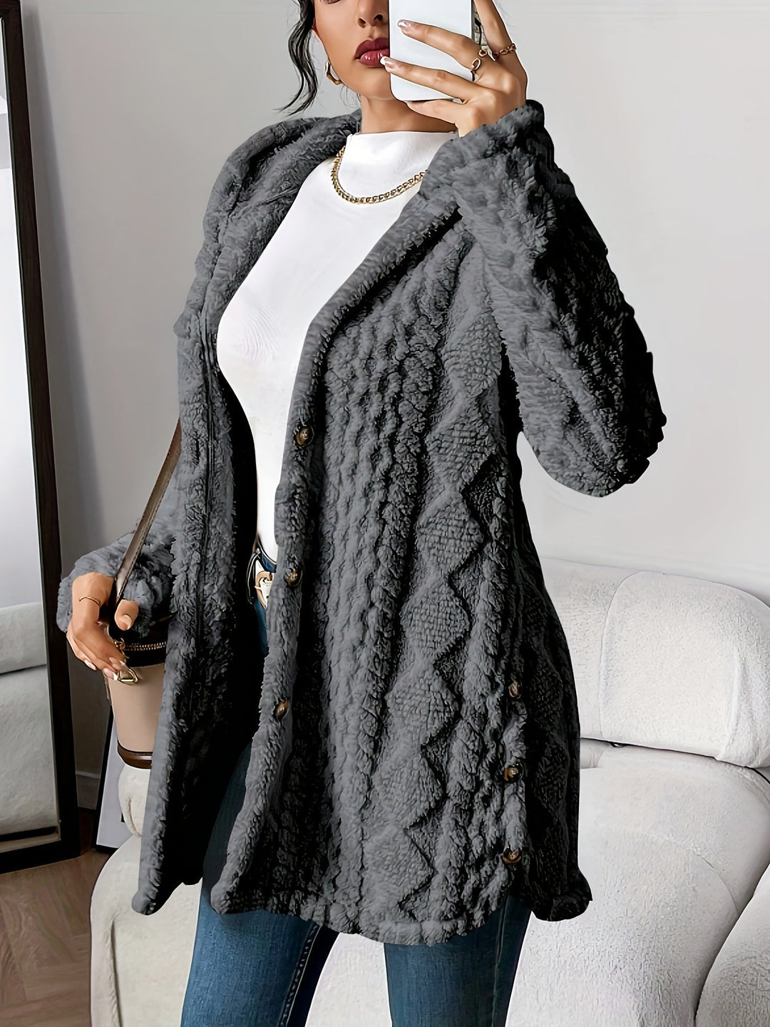 Loose fit women's long hooded button-front coat, elegant textured outerwear for fall/winter style.