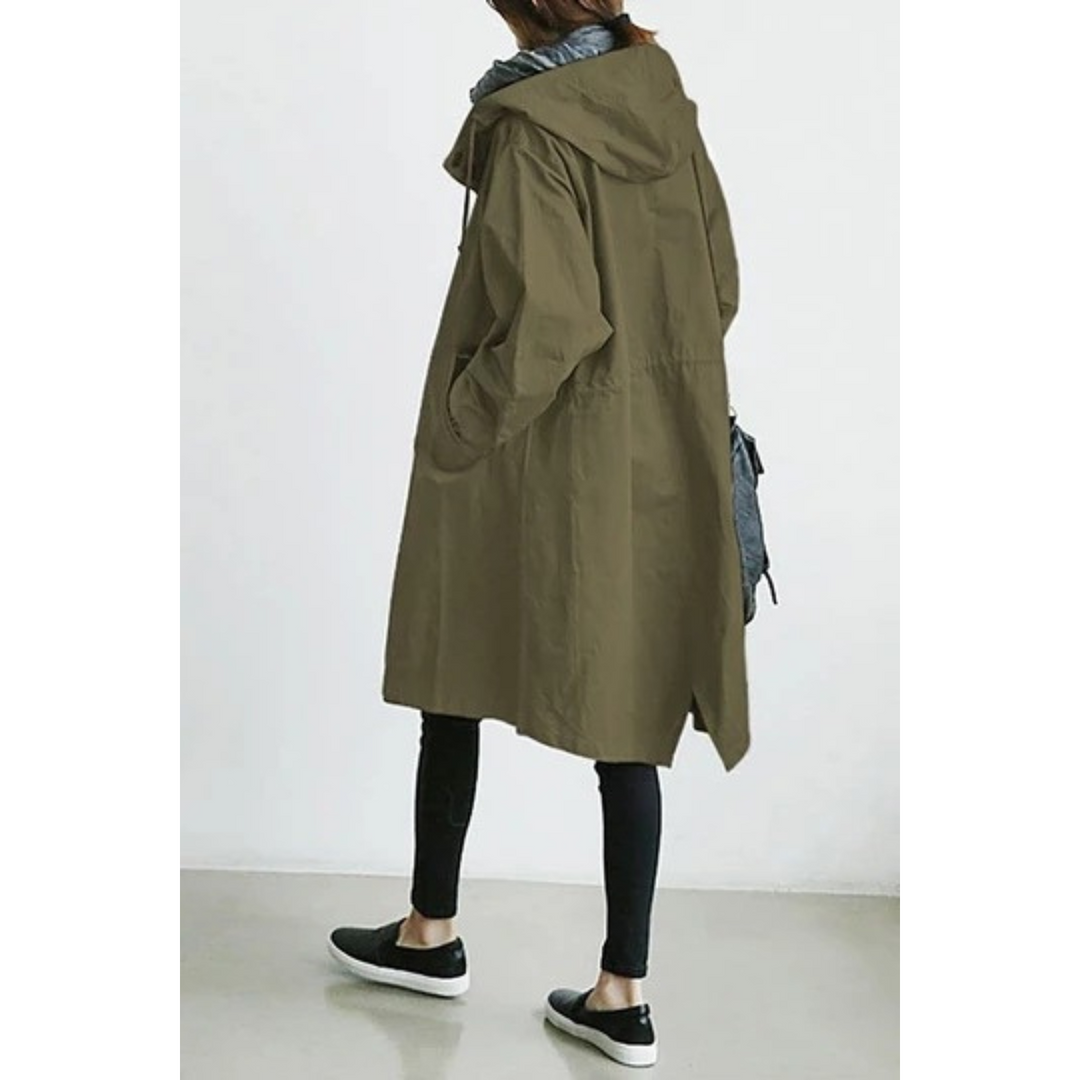 Fashionable women's long hooded trench coat. A chic rain jacket & windbreaker for modern style.