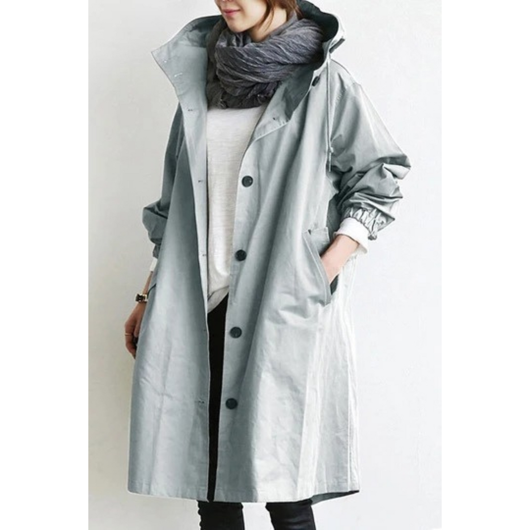 Chic women's long hooded trench coat. A versatile weatherproof rain jacket & windbreaker for women.