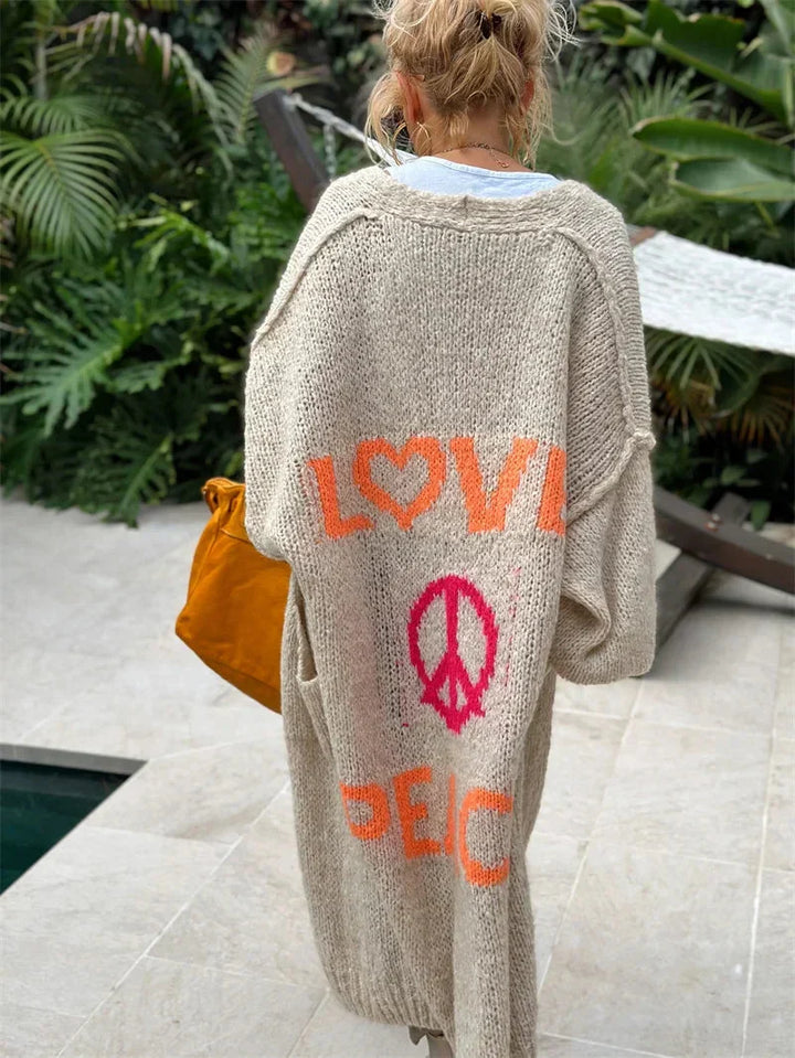 Vibrant oversized bohemian longline cardigan for women, an open-front knit for relaxed, unique style.