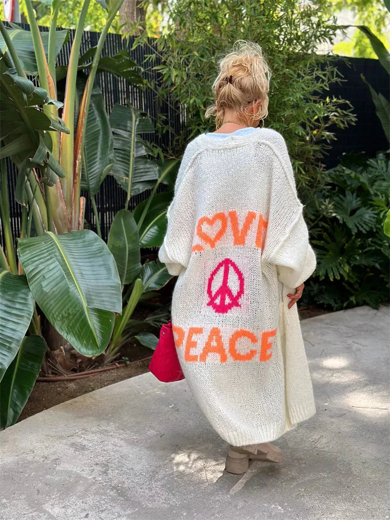 Women's relaxed fit oversized bohemian knit cardigan, a long statement piece with a unique design.