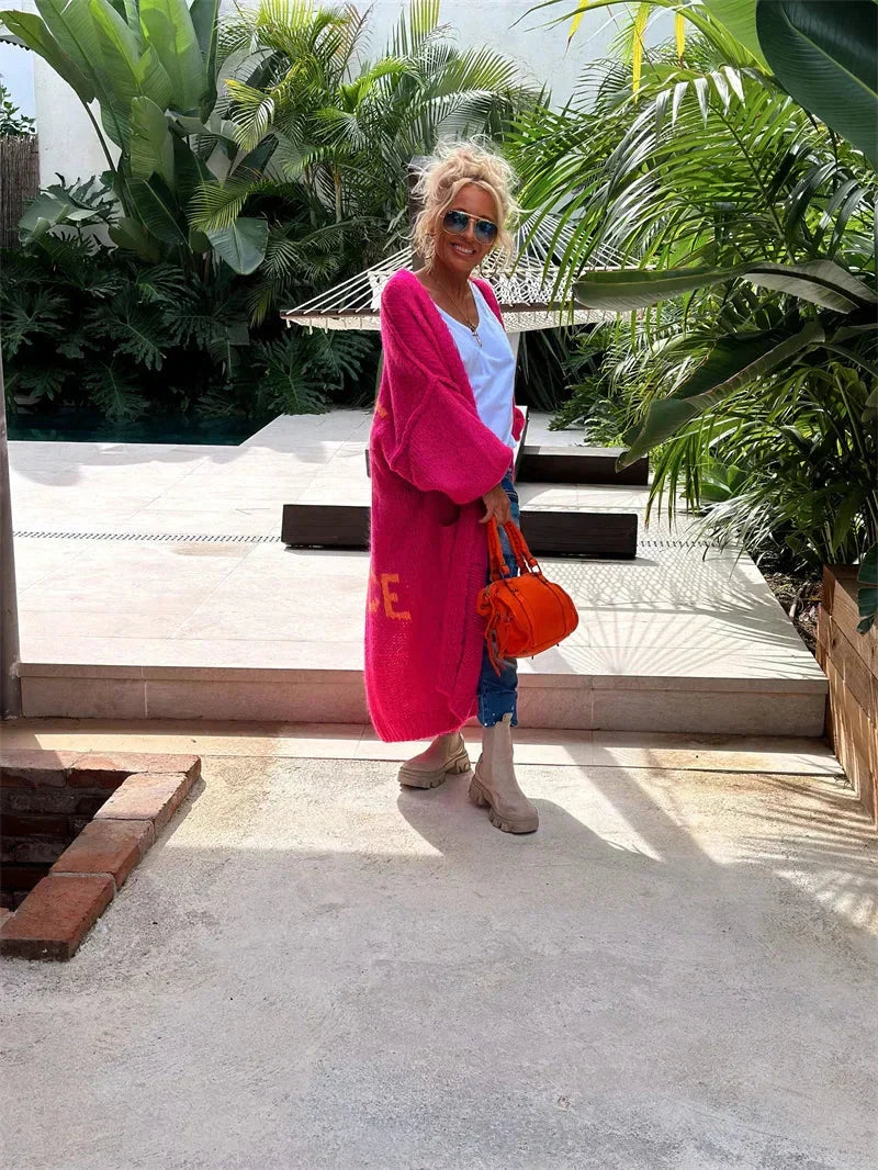Stylish women's long oversized bohemian cardigan, a vibrant open-front knit for casual wear.
